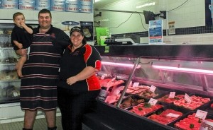 Tin Can Bay Family Butchery proprietors Scott and Stacey Barker with son Hayden