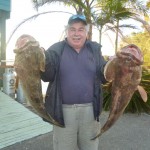 Regular Rod with his 2 Gold Spot Cod blue sky