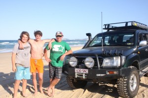 Regular visitors James Sharpe,  Bailey and Paul Berriman from Gympie would like to see the beach fees disappear