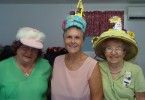 Linda Murphy, Lorraine Bishop and Elwyn Slaughter at an impromptu Easter Bonnet Parade produced quite a variety of headwear - which generated much laughter and cheer!