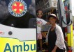 Amir Matthews hops on board the ambulance with mum, Lily