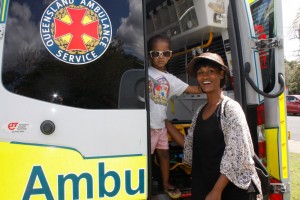 Amir Matthews hops on board the ambulance with mum, Lily