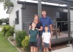 Melanie and Steve May with sons Thomas and Jackson outside one of their cabins, growing in number at the Tin Can Bay Tourist Park