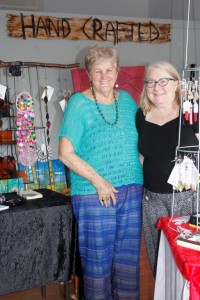 Lyn Barrett and Denise Adams with crafty wonders at the their new shop, near the Rainbow Beach IGA