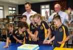 Micheal Grogran and Honorable Warren Truss, Federal Member for Wide Bay, congratulate the new student leaders as they cut the cake at the special celebratory morning tea with their families
