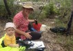 Bonnie assists mum, Jess Milne, take a water sample reading at Snapper Creek for Cooloola Coastcare