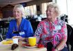 Colleen Yallowley and Carmel Darcy having coffee at the Surf Club
