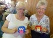 Jacki Cross and Bev Phillips with the their owl purses made in felt