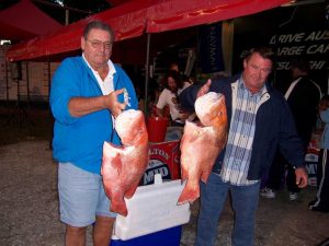 Milton Modin (left) is a record holder for sweetlip and jewfish