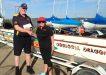 Coastguard representative John MacFarlane receives a donation from President Sandra Wooster