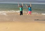 12-year-old twins, Olivia (left) and Jacinta Sullivan are jumping for joy to be at the best winter beach away from cold Toowoomba! Image Alison Sullivan