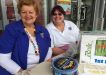 Irene Manwaring and Debbie Vines selling QCWA raffle tickets