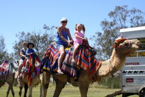 It was all smiles on the camel ride for locals Wynetta and Skye Duggan