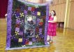 Sue Maddison with her beautiful quilt