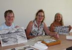 Gayle Young, Ann Thornton and Ze show off their creations from the library art workshops