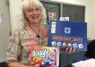 Coralie Leslie from Community Information and Resource Centre shows some of the games for hire