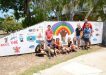 Michael Grogan with Year 6 students and their new mural at Rainbow Beach Police Beat