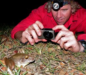 Adam Logan with Giant barred frog