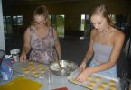 CCYAP - Shervawn Wilson and Britney Rose cutting cookies