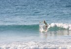 10-year-old Seth Parton surfs at Double Island Point