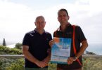 Mark Beech from Rainbow Ocean Palms Resort and Heatley Gilmore from Rainbow Getaway Holiday Apartments show off Rainbow Beach's publication for New Zealand, called Visit Rainbow Beach