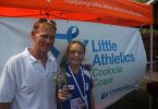 Coach Bill McKechnie presents Anjelica Geurts with Cooloola Coast Little Athletics 2016 Athlete of the Year