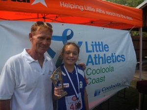Coach Bill McKechnie presents Anjelica Geurts with Cooloola Coast Little Athletics 2016 Athlete of the Year 