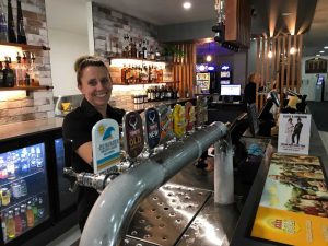 Teena Lee is all smiles behind the brand new bar at the Tin Can Bay Country Club