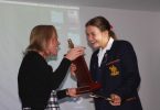Principal Dr Julie Wilson Reynolds presents Kate with the Ammonite Award - St Hildas's Rowing's highest honour