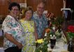 Judy Cantrell, Maree and Phil Heron discuss the themed displays - spotting"Days of Wine and Roses" and the "Yellow Rose of Texas"