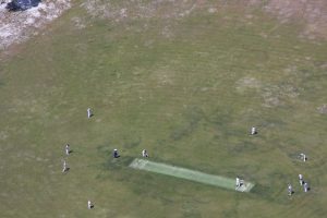 Although it is amazing to see Rainbow Beach Cricket Club play from the sky, (taken from Rainbow Beach Helicopters), the local cricket club encourage spectators from the ground too!