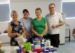 QCWA Member Joan, Debbie, Dawn and Mark with some of the Care Pack items