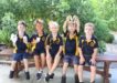 Rainbow Beach State School preppies, Casey, Zay, Roy, Liam and Darcy enjoy a sausage and game of handball at the Welcome BBQ.