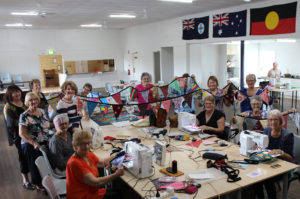 Frayed Edges members creating the bunting for the You Make My Heart Sing - Small Halls events.