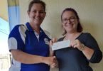 Cooloola Coast Little Athletics Centre Manager, Jess Milne recieves the donation from Chamber of Commerce President Bianca Hayward