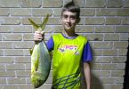 Caleb Jensen was absolutely thrilled with his new rod and he caught a GT off the Tin Can Bay jetty, weighing just over 2kg - he thanks the club for hosting the Sunfish Junior fishing day
