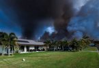 Peter Thwaites took this dramatic photo in front of his home in Cooloola Cove, entitled ".... when you've just got to have faith in the local fire fighting crews during their winter burn off."