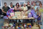 The QCWA team proudly display the gifts, groceries and food destine for drought affected families for Christmas