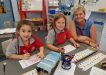 Chappy Karen helping Alyssa Latimore Eliza O’Driscoll find a word at Tin Can Bay School