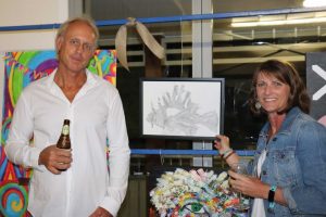 Grant and Kathy McFarlane with Kathy’s ARTYball sketch of Grant’s Lionfish 