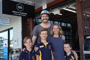 Brent and Alex with kids, Ruby, Max and Henry, outside their new business “Brent’s Burgers”