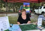 Joan Creswell, Secretary / Treasurer of CCR&F selling tickets at Cooloola Cove Markets, the first Saturday morning of the month