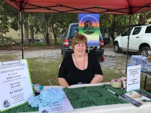 Joan Creswell, Secretary / Treasurer of CCR&F selling tickets at Cooloola Cove Markets, the first Saturday morning of the month