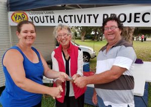 Chris and Glenys from Colbridge Amusements present YAP President Jess Milne with $500