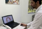 Dr Abhi Sharma, from Cooloola Cove Smiles at Tin Can Bay - designing a crown on the three-dimensional scan