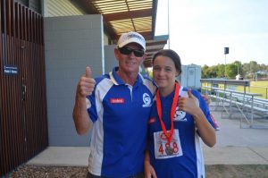 U12 Anjelica Geurts with Coach Bill give her silver medal win a thumbs up