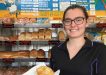Cleressa Clark of Rainbow Beach holds the famous corn beef and white sauce pie from Ed’s Beach Bakery at Rainbow Beach - listed as No. 1 for Top Ten Pies around Australia, by Creek to Coast