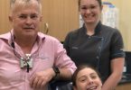 Emily-Jane Davey very excited to be finished orthodontic treatment and have her bands taken off - here with Dr Mark and Dental Assistant Chloe Williams