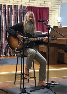 One of our performers Rob, who uses his love of playing the guitar to raise money for the Youth Activity Project. You can often hear him at the markets, in restaurants and at our musical evenings.