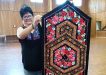 Leonie from the Tin Can Bay Quilting Club with her dazzling table runner